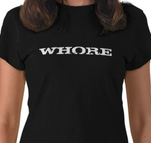 a woman wearing a tshirt that says "whore"